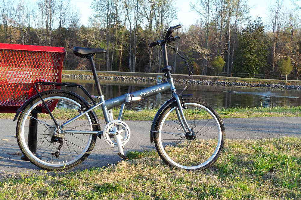 Dyan folding bike standing near the water