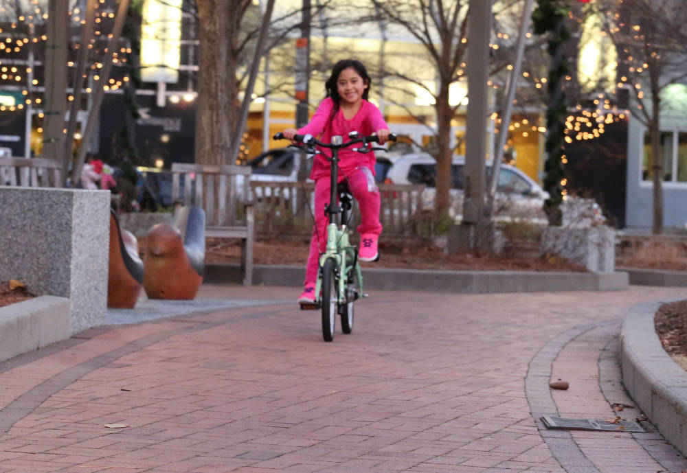 a 7 yr old on a mini folding bike